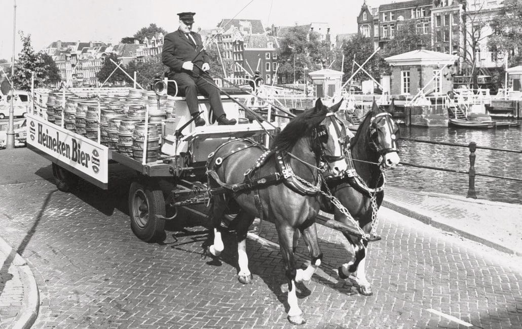 Barrels of Heineken delivered by horse-drawn cart in the 1800s